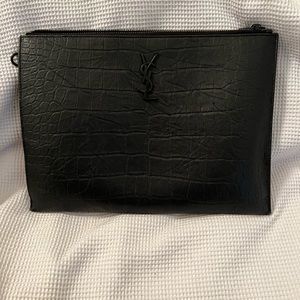 YSL Cassandra tablet pouch, good condition. Edges show wear, wrist strap missing